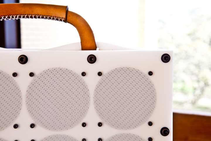 Photo of sixteen-bit guitar amplifier, showing 16 speakers and stacked laser cut delrin construction