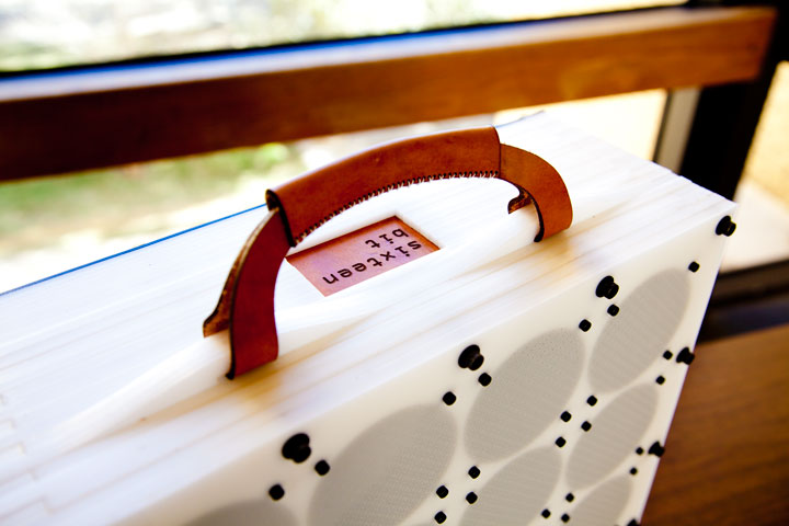 Photo of sixteen-bit guitar amplifier, showing 16 speakers and stacked laser cut delrin construction