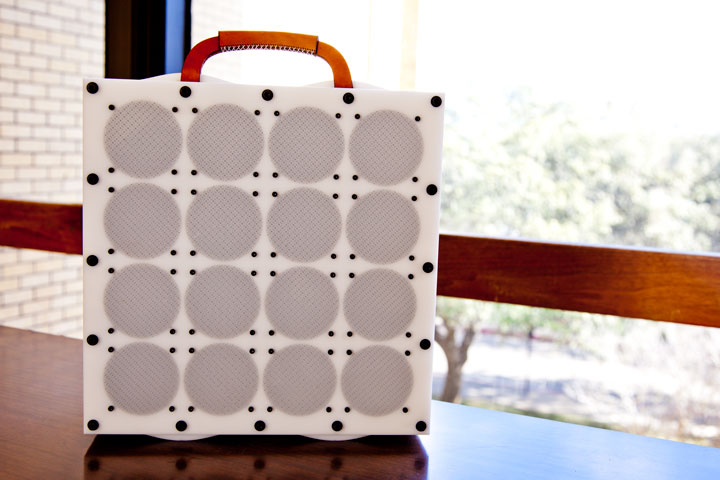 Photo of sixteen-bit guitar amplifier, showing 16 speakers and stacked laser cut delrin construction