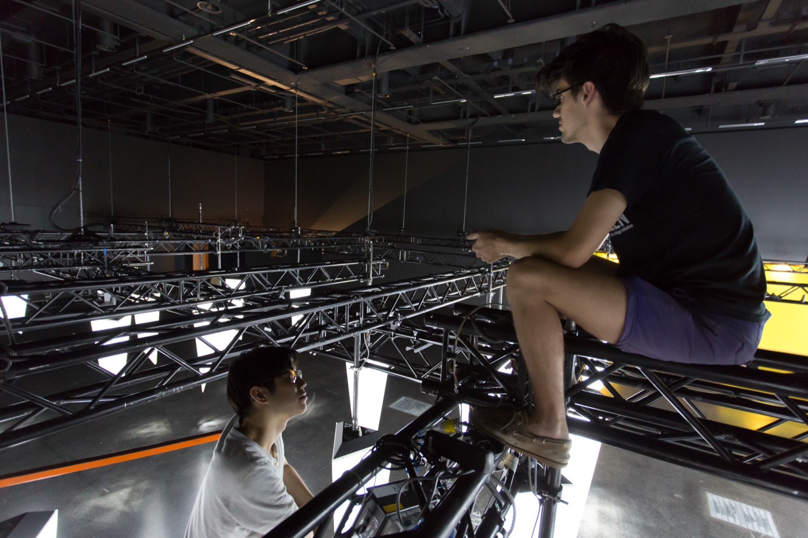 Me, sitting on top of the trusswork while installing the artwork in Basel