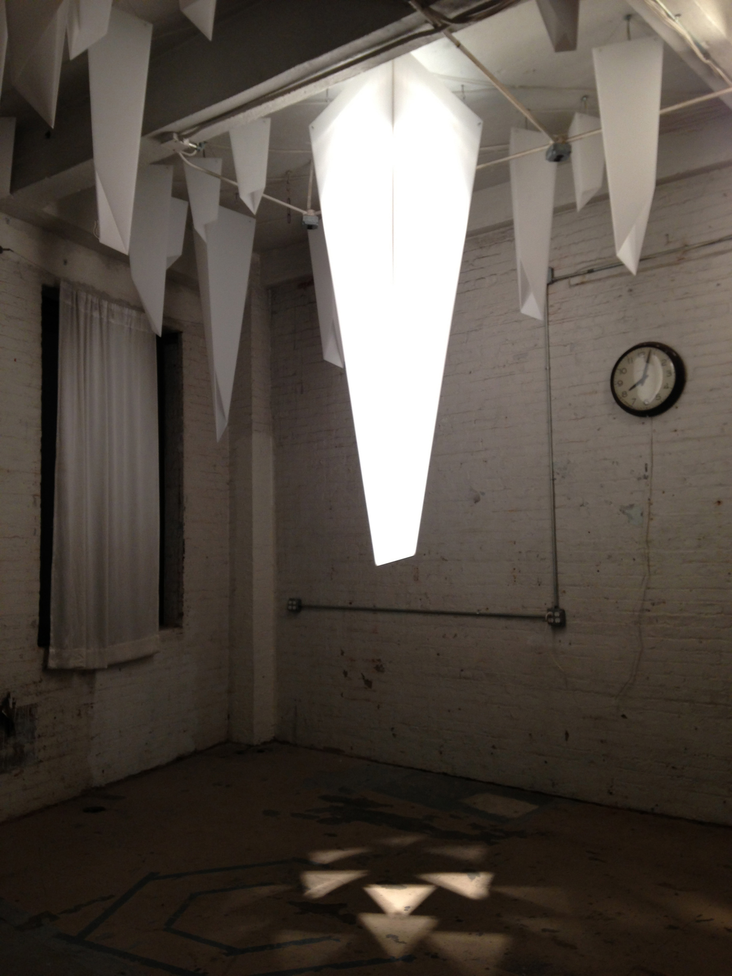 Triangular patterns projected by kaleidoscopic reflection of LEDs inside each tetrahedral form